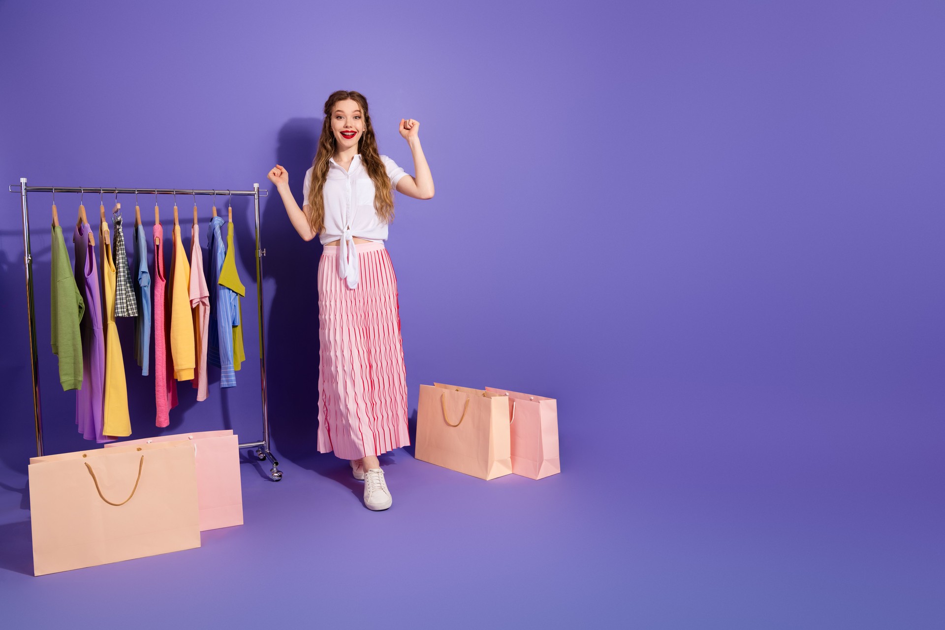 Charming young woman with a stylish outfit and shopping bags in vibrant setting emphasizing fashion and lifestyle